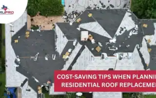 Roofers inspecting a residential roof during replacement project.